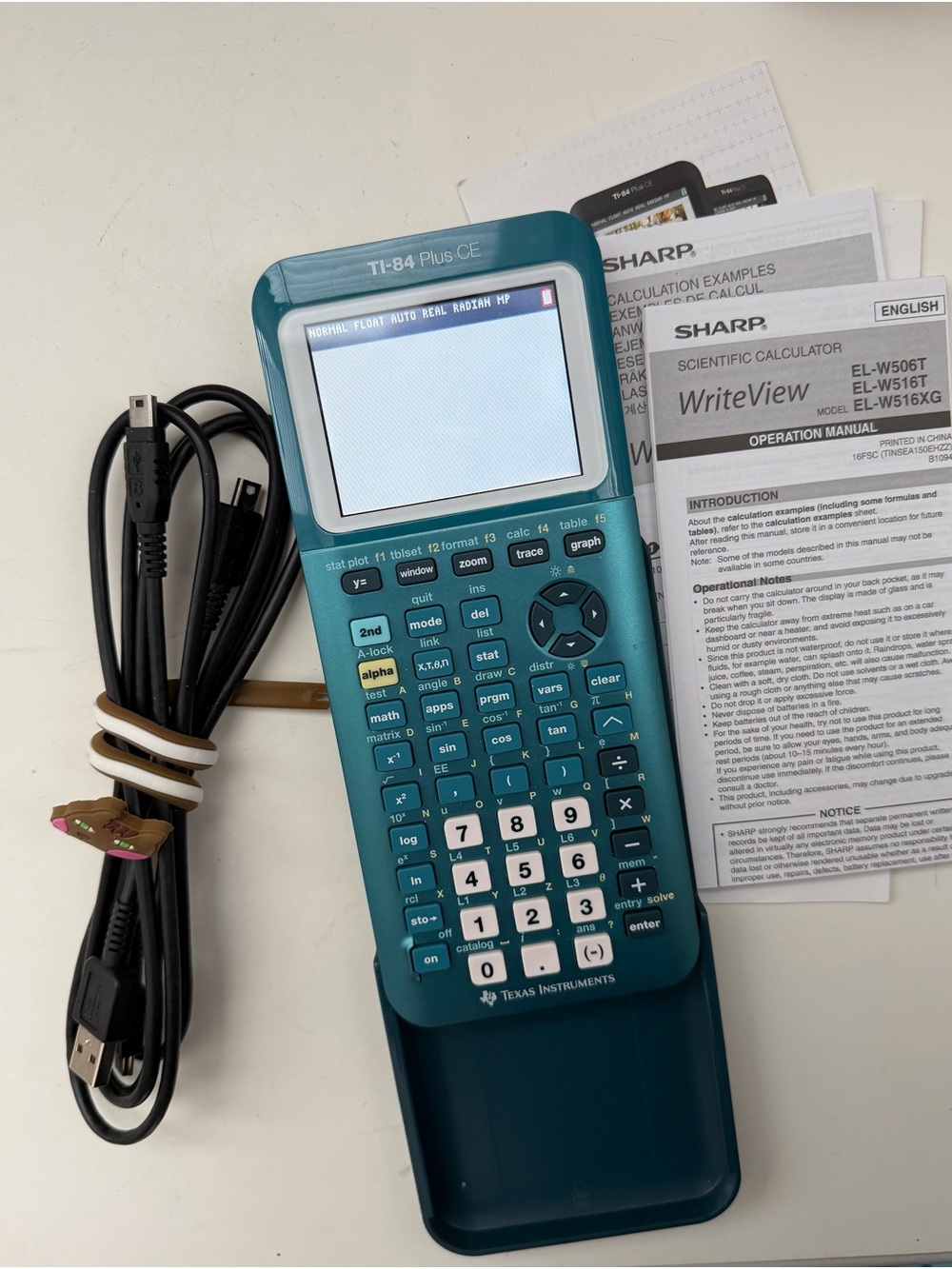 Texas Instruments Teal TI-84 Plus CE Graphing Calculator with Cable